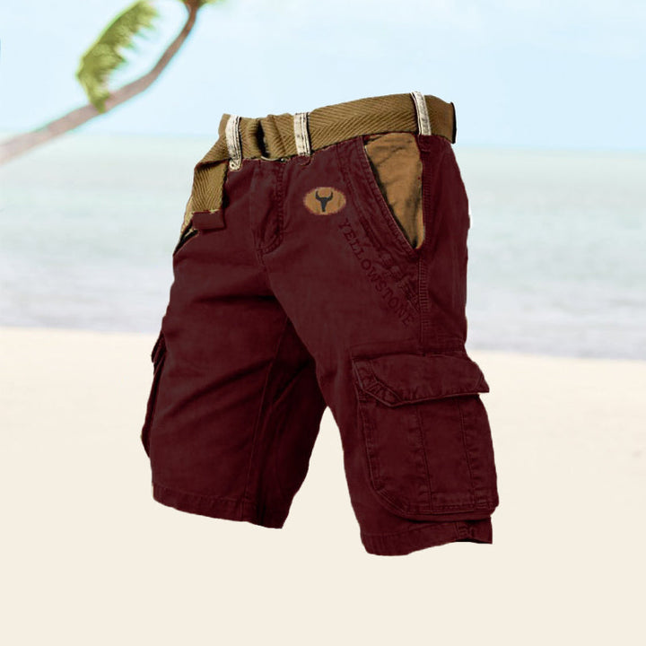  Male model showcasing cargo shorts with a comfortable everyday look on a plain background.