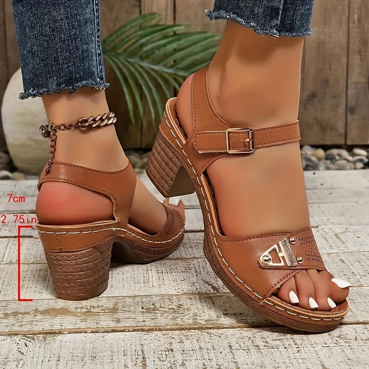 Women’s warm-weather sandals with adjustable closures on a plain background.