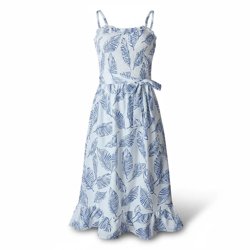 Midi dress with adjustable straps and an all-over botanical print on a plain background.
