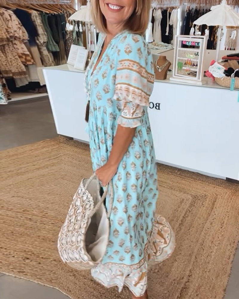 Boho-inspired dress on a plain background designed with graceful flow and easy coverage.