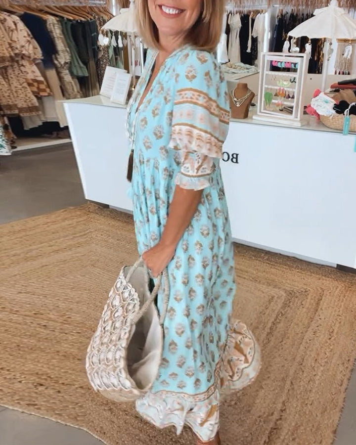 Boho-inspired dress on a plain background designed with graceful flow and easy coverage.