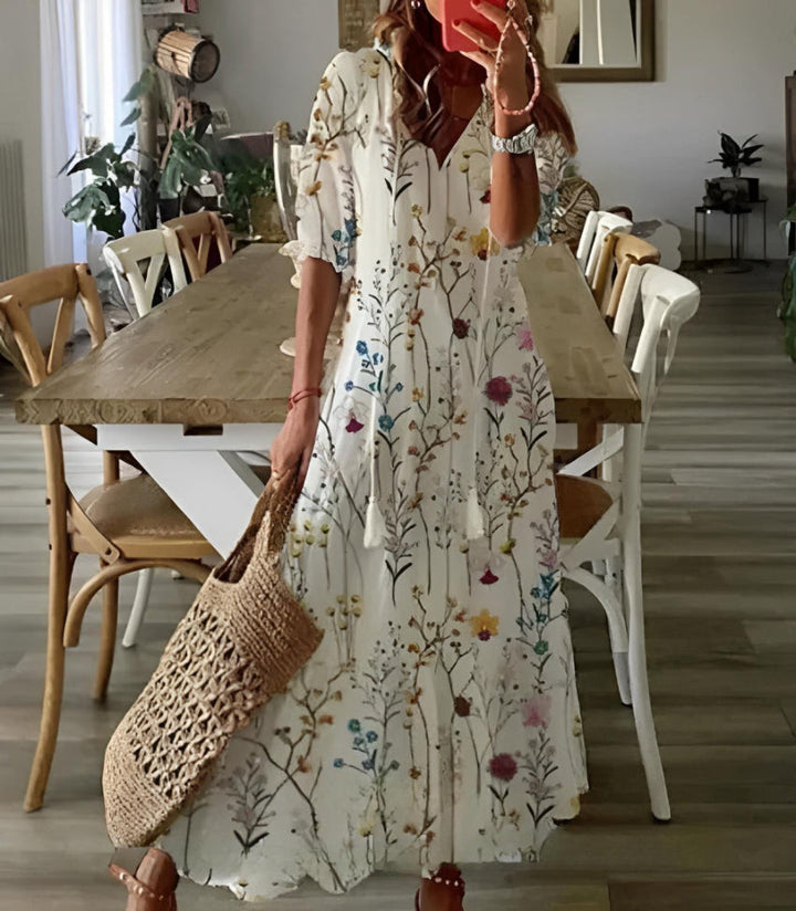A feminine vintage-style maxi dress with a relaxed bohemian shape.