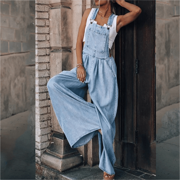 Relaxed women’s denim one-piece jumpsuit with button bib detail.