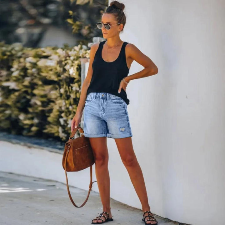 Female model wearing lightweight high waist shorts on a clean background.