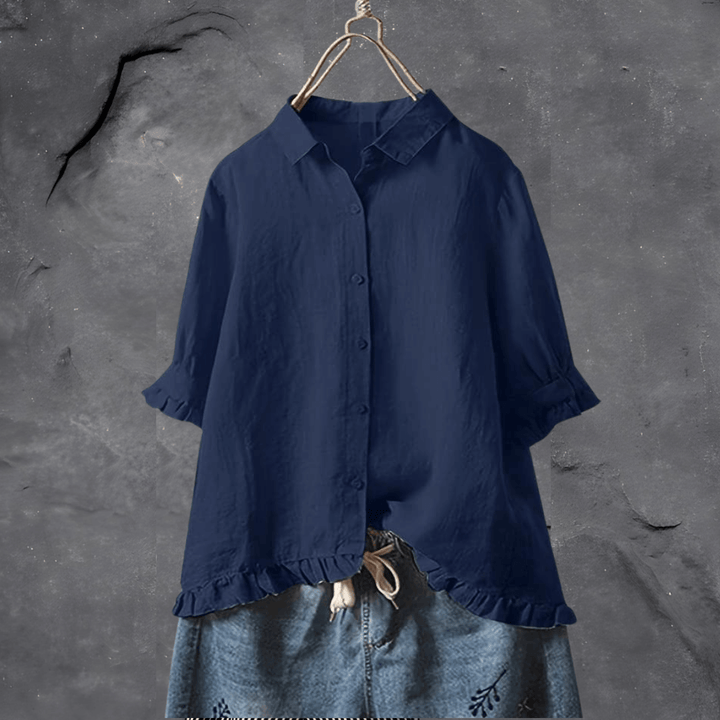 Elegant women’s lightweight blouse on a clean background with a softly flowing relaxed silhouette.
