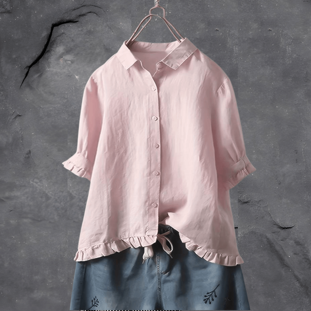 Refined women’s blouse on a clean background featuring a relaxed fit and polished everyday style.