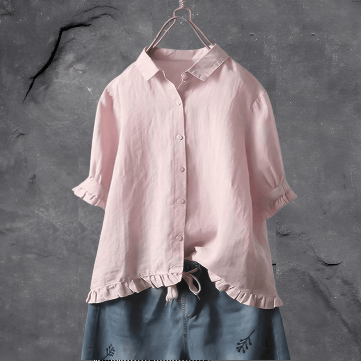 Refined women’s blouse on a clean background featuring a relaxed fit and polished everyday style.