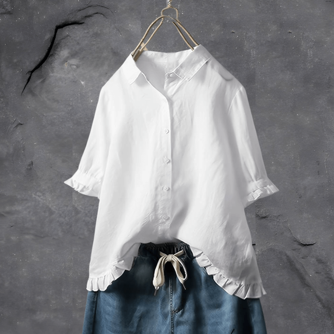 Chic women’s airy blouse on a clean background with a graceful draped fit.