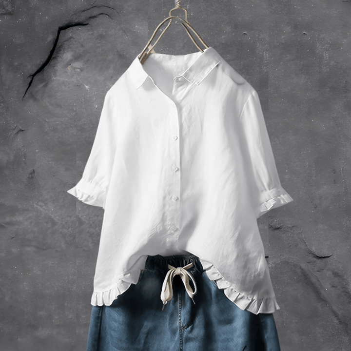 Chic women’s airy blouse on a clean background with a graceful draped fit.