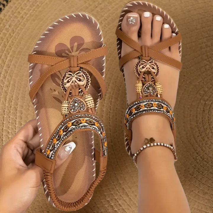 Foot wearing lightweight casual sandals on a clean background.
