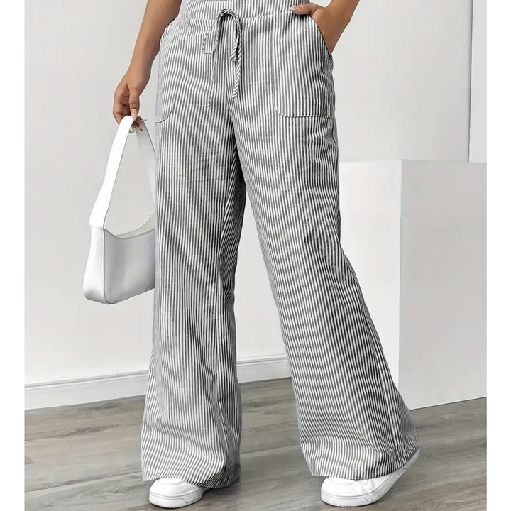 Flattering vertical stripe pants with pockets shown on a plain background.