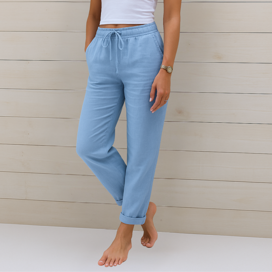 Woman styled in lightweight elastic waist trousers on a plain background.