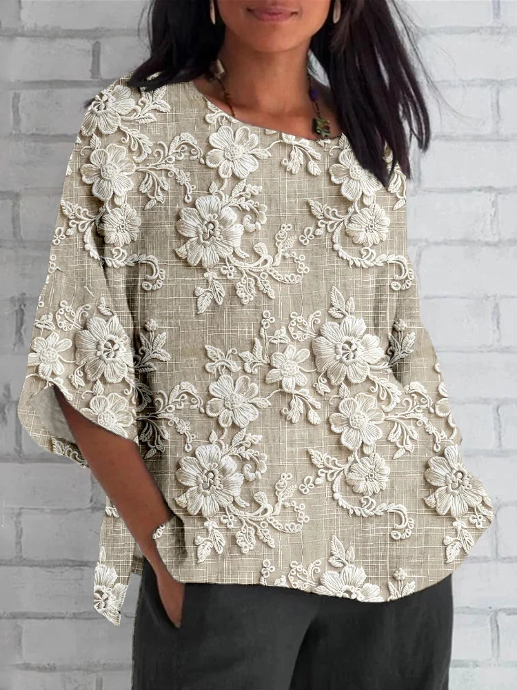 Vintage floral blouse with model on a clean background showcasing a relaxed elegant fit.