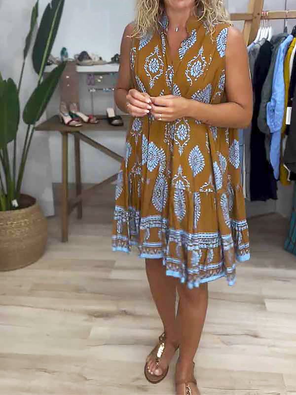 Woman wearing a V-neck boho mini dress in earthy tones