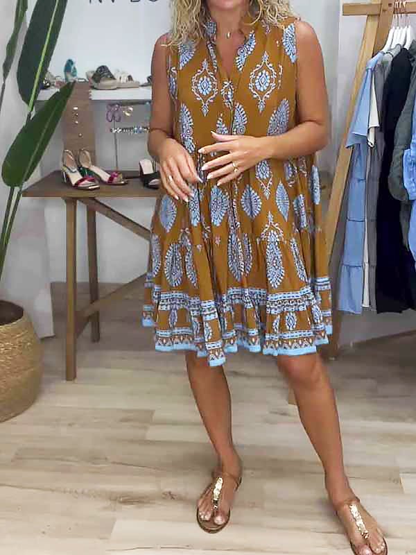 Female model wearing a sleeveless boho print mini dress