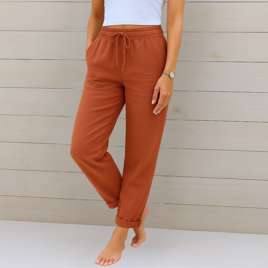 Female model in comfortable stretch waist pants with a clean background.