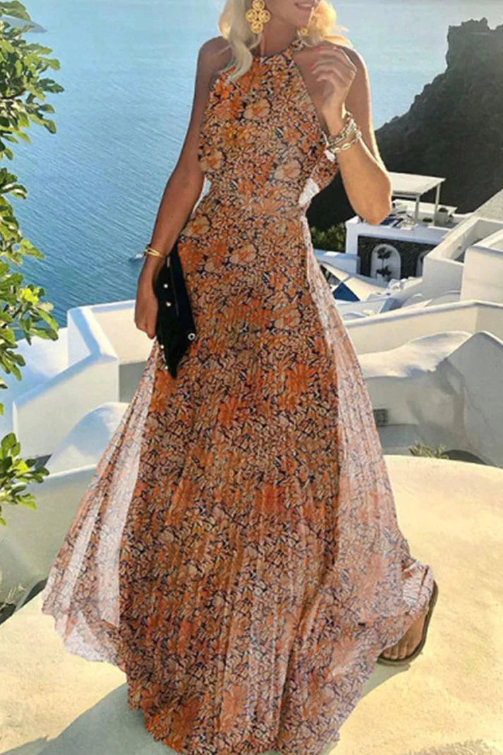 Woman in a vacation-inspired printed maxi dress with elegant movement on a ocean background.