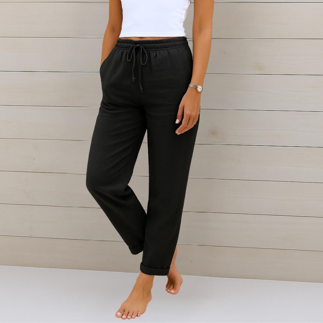 Female model showcasing breathable women’s pants against a clean background.