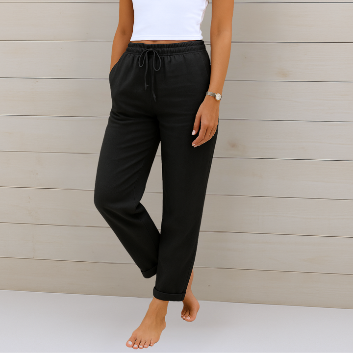 Female model showcasing breathable women’s pants against a clean background.