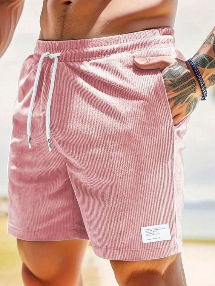 Male model in textured casual shorts displayed on a plain background.