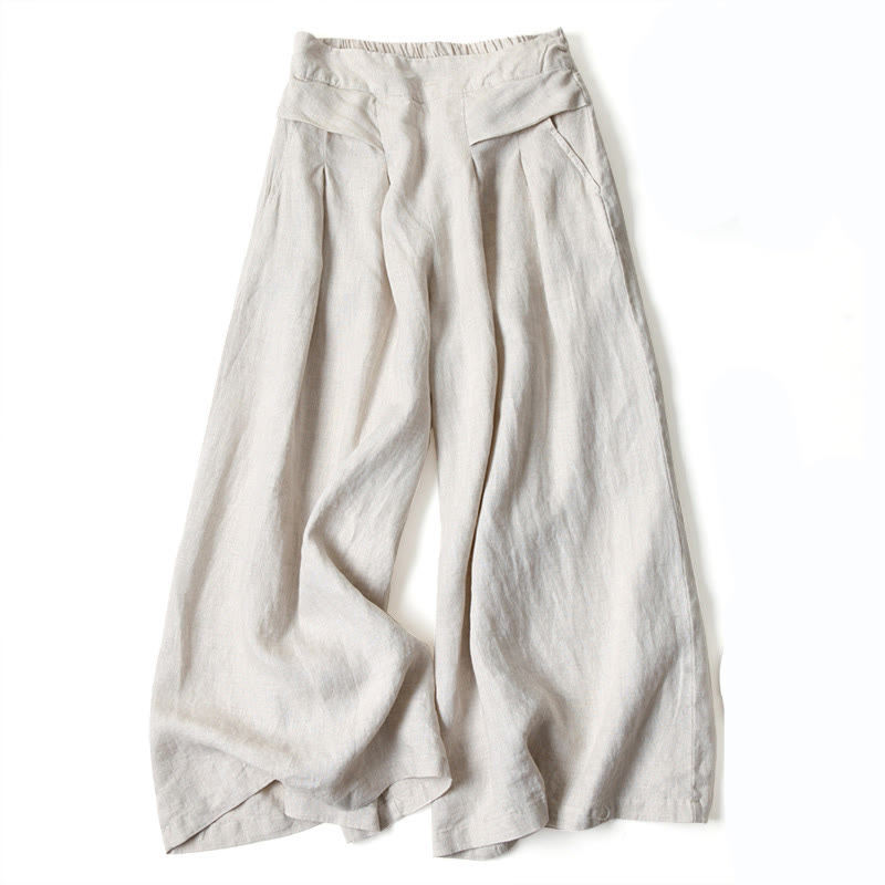Female wide-leg trousers shown on a plain background with a loose draped fit.