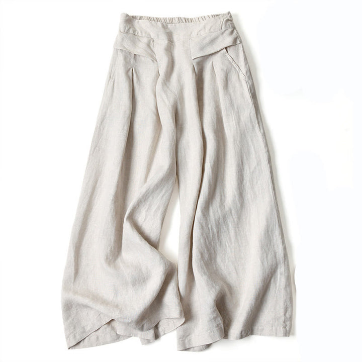 Female wide-leg trousers shown on a plain background with a loose draped fit.