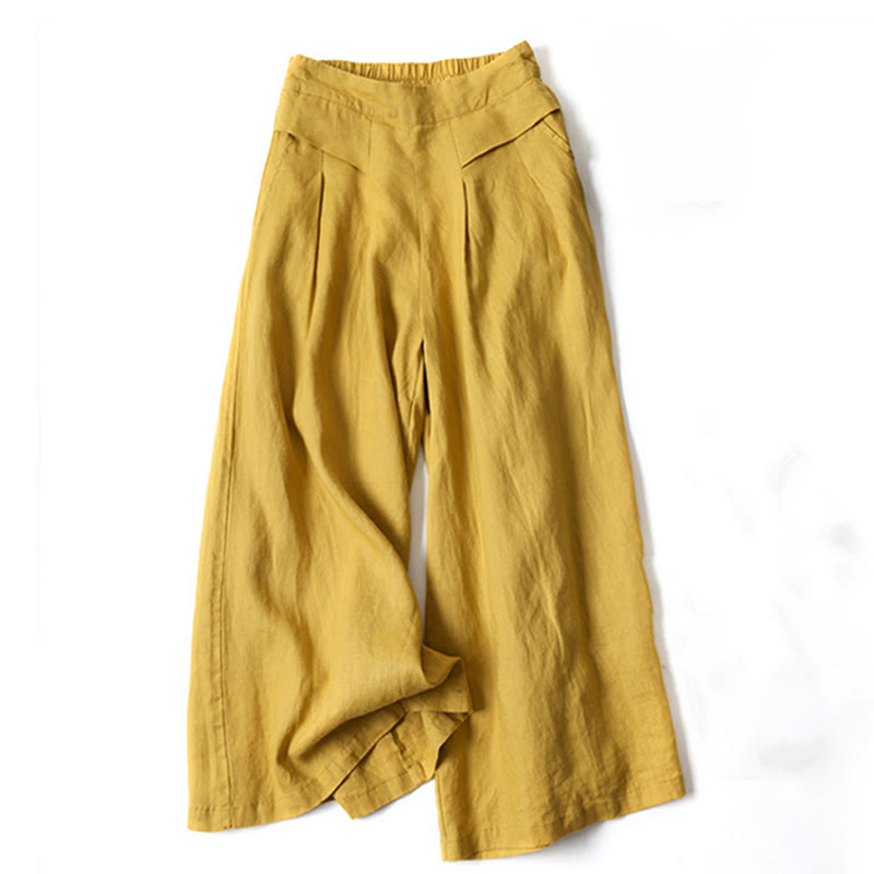 Women’s wide-leg relaxed pants displayed on a plain background with a soft flowing silhouette.