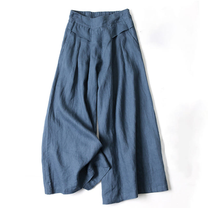 Lightweight women’s wide-leg trousers displayed with a soft waistband and relaxed shape.