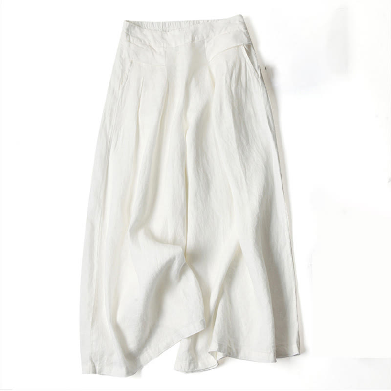 Flowing wide-leg pants for women shown on a simple plain background.