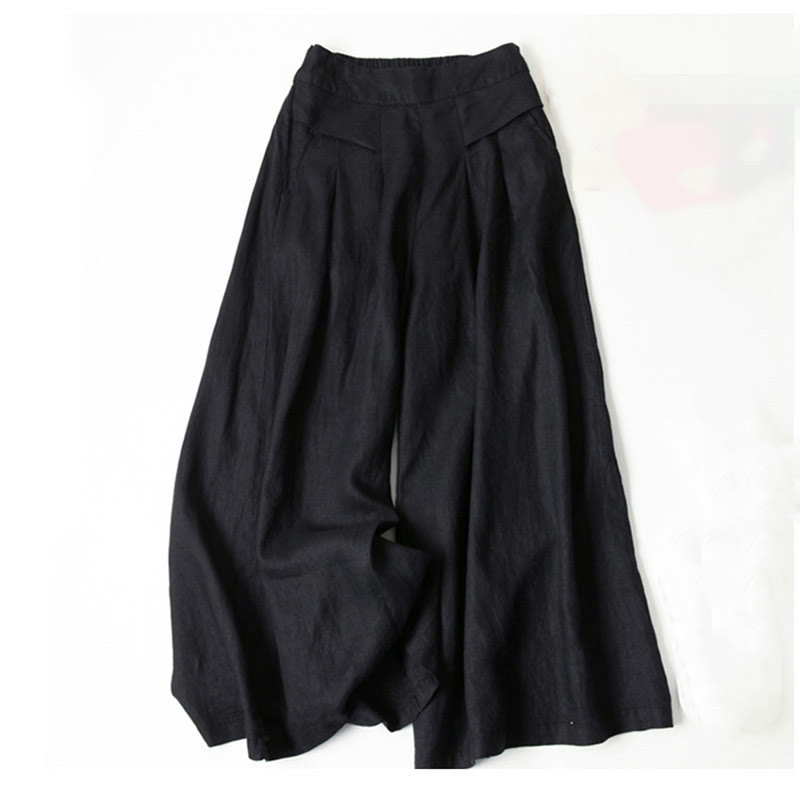 Women’s relaxed wide-leg pants displayed against a beige background for everyday styling.