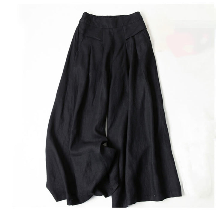 Women’s relaxed wide-leg pants displayed against a beige background for everyday styling.