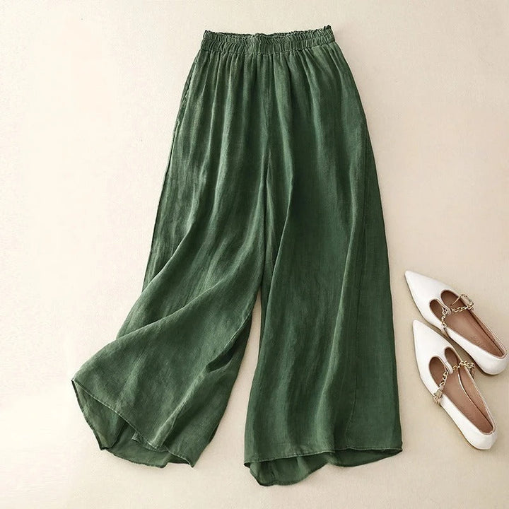 Elegant wide-leg pants for women shown on a plain beige background.