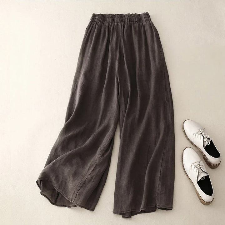 Relaxed waistband pants with a soft flowing silhouette on a beige background.