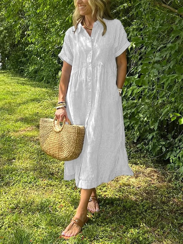 Striped women’s long shirt displayed w/ model on a green background.