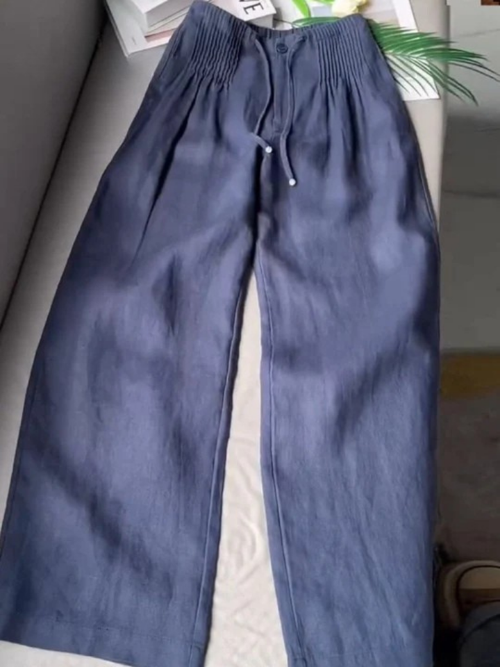 Wide-leg pants displayed on a plain background with a flowing relaxed silhouette.