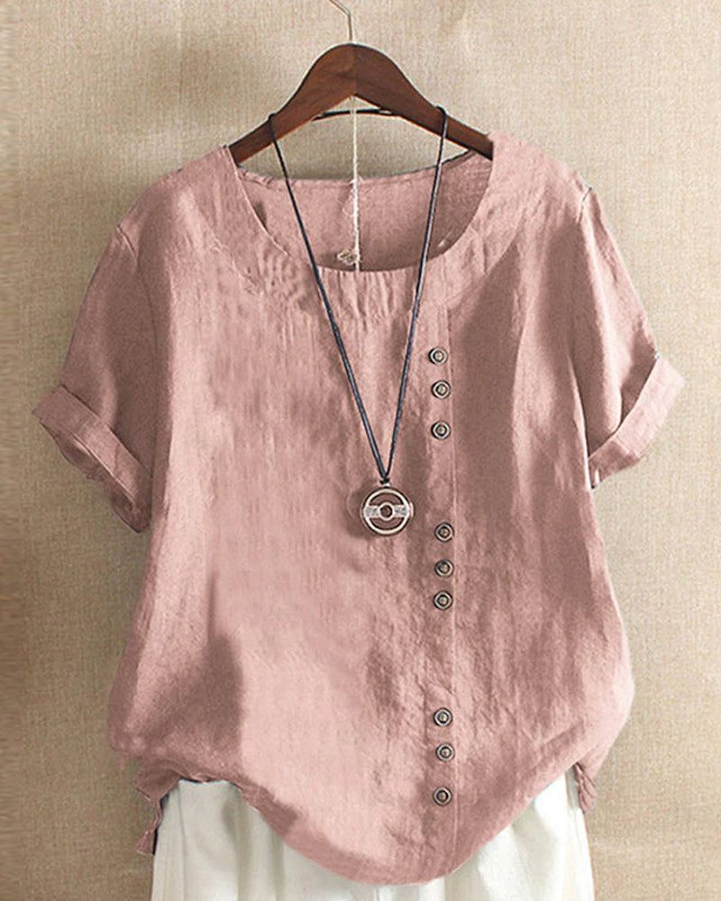 Natural linen blouse with button front on plain background.