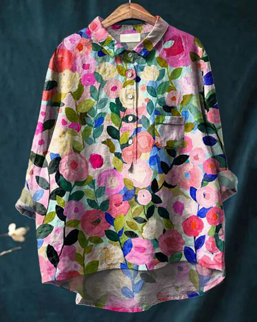 Floral women’s blouse against a plain background.