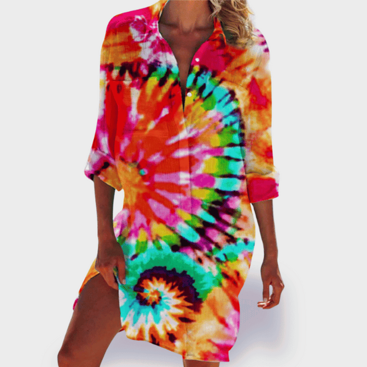 Colorful flowing summer dress with a relaxed fit and vibrant pattern.