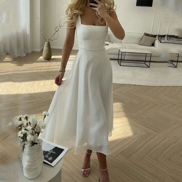 Woman wearing elegant midi dress posing indoor natural sunlight