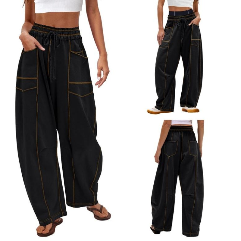 Female model wearing wide-leg cargo pants on a plain background.