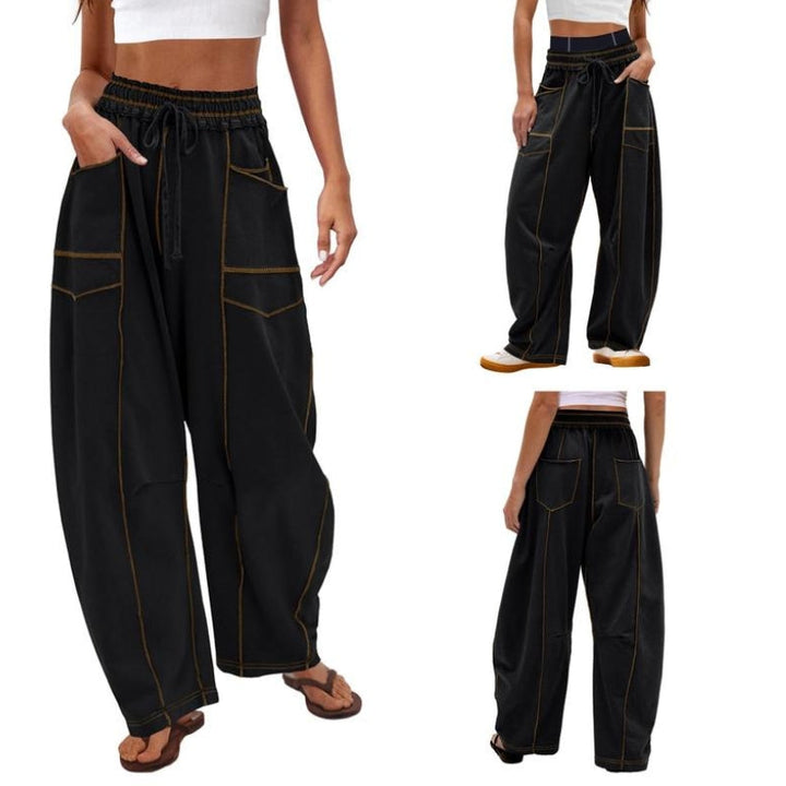 Female model wearing wide-leg cargo pants on a plain background.