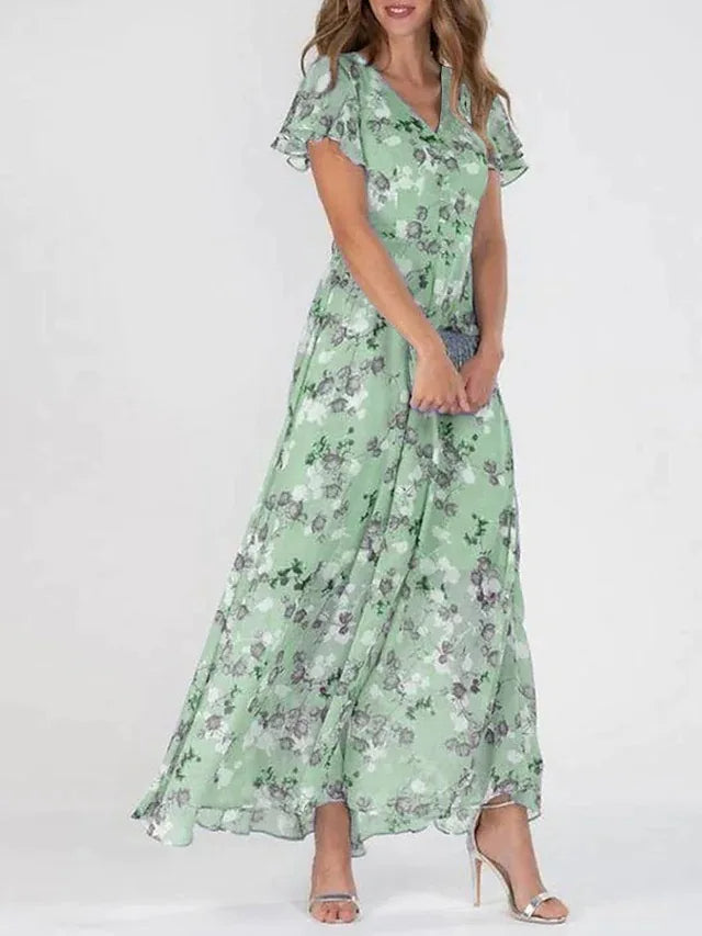 Woman in a chic full-length dress with graceful midsection coverage on a plain background.