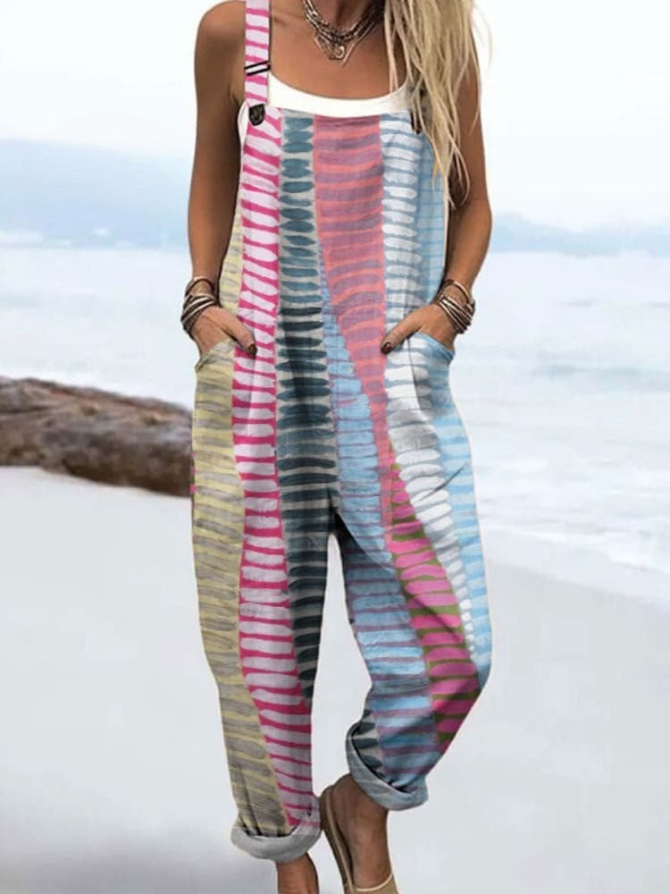 Woman in a charming one-piece outfit with playful accents on a plain background.