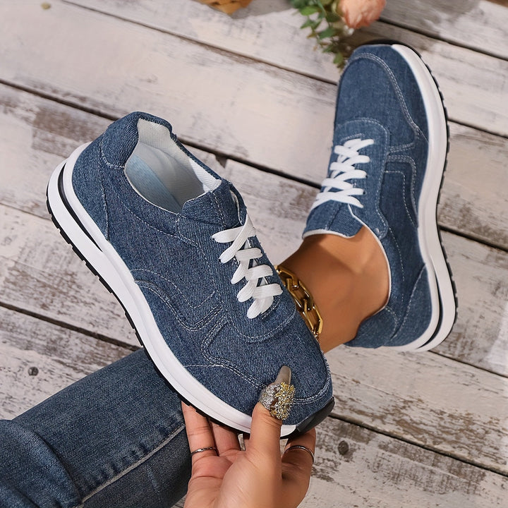 Casual women’s sneakers shown from the side on a plain background.