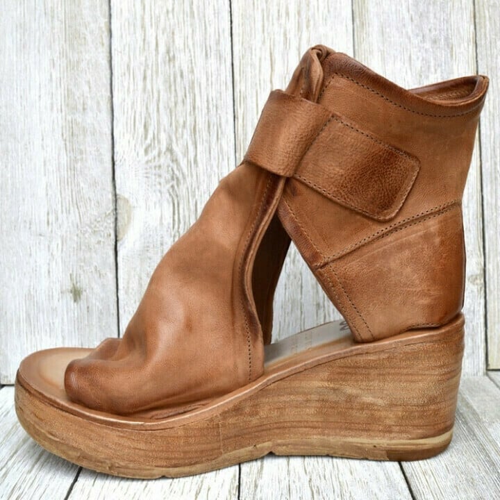 Supportive open-toe wedge sandals shown on a clean background for daily styling.