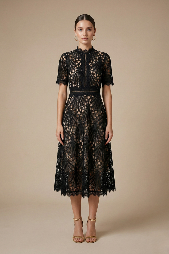 Female wearing a lace midi dress with a high neckline and short sleeves against a plain background.