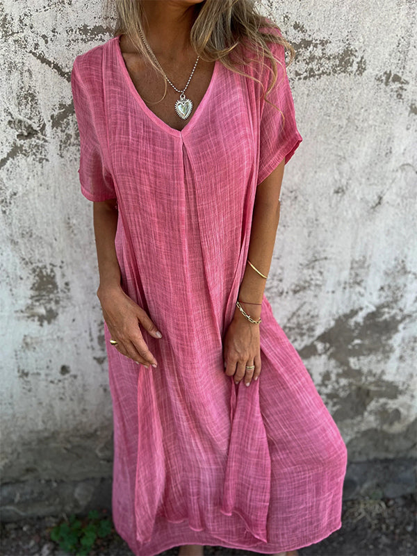 Flowing women’s maxi dress with elegant movement on a neutral background.