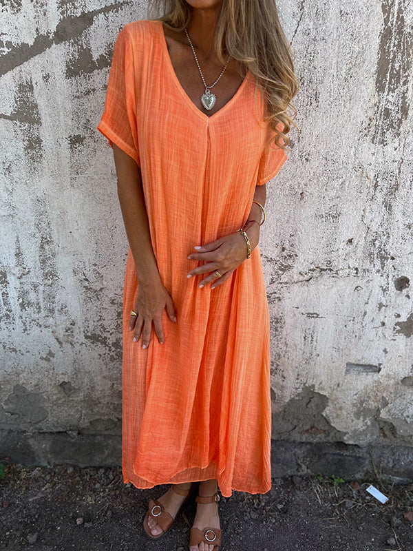 Female model showcasing a graceful long dress with timeless style.
