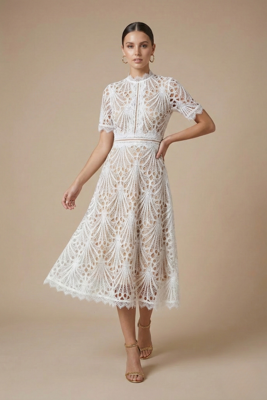 Female showcasing a high-neck lace midi dress with short sleeves and a flowing silhouette against a plain background.