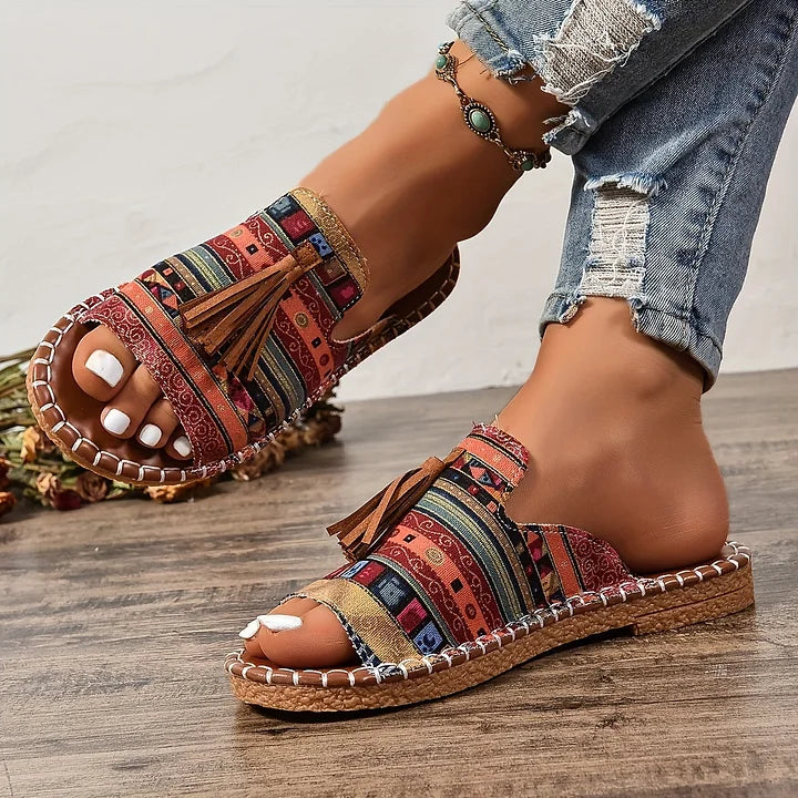 Bright cushioned sandals for warm-weather outfits shown on a plain background.